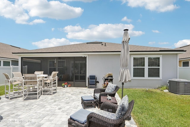 44 Spotted Owl Ln, Saint Augustine, FL 32095 - back of property with a patio area, a sunroom, stucco siding, roof with shingles, and outdoor dining area