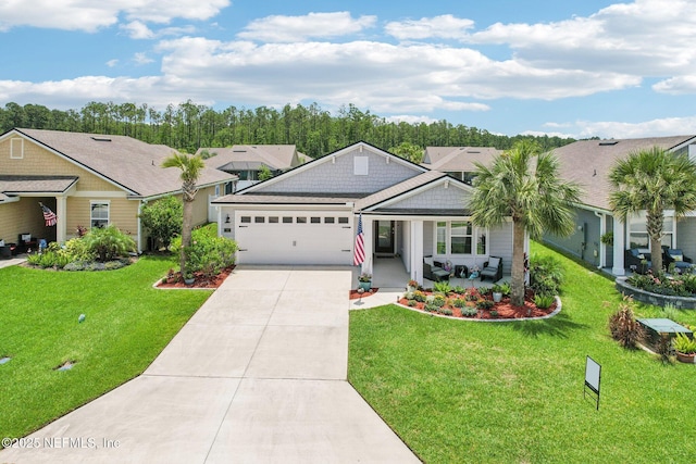 44 Spotted Owl Ln, Saint Augustine, FL 32095 - view of front of home with a garage, driveway, a front yard, and a porch