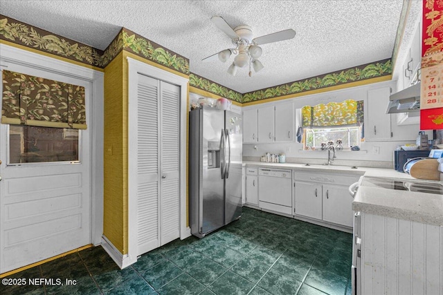 1179 Kincross Ct, Orange Park, FL 32065 - kitchen with white appliances, ventilation hood, light countertops, a ceiling fan, and white cabinets