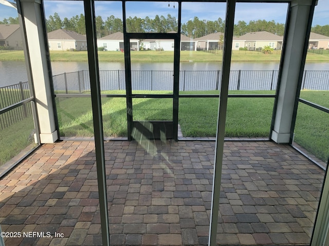 488 Broomsedge Cir, Saint Augustine, FL 32095 - unfurnished sunroom featuring a water view, a residential view, and healthy amount of natural light