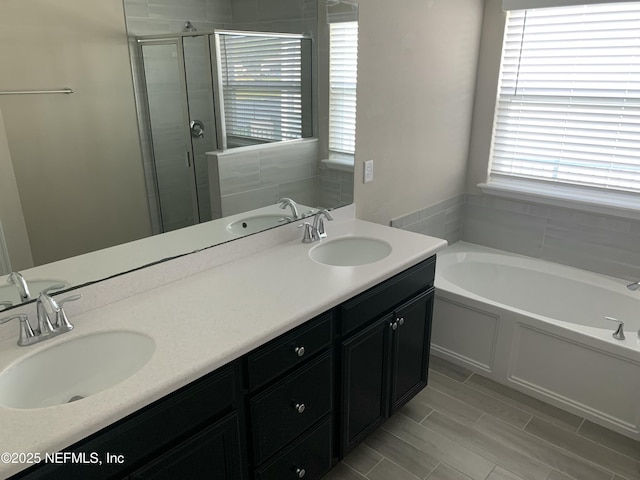 488 Broomsedge Cir, Saint Augustine, FL 32095 - bathroom featuring a shower stall, a bath, and double vanity