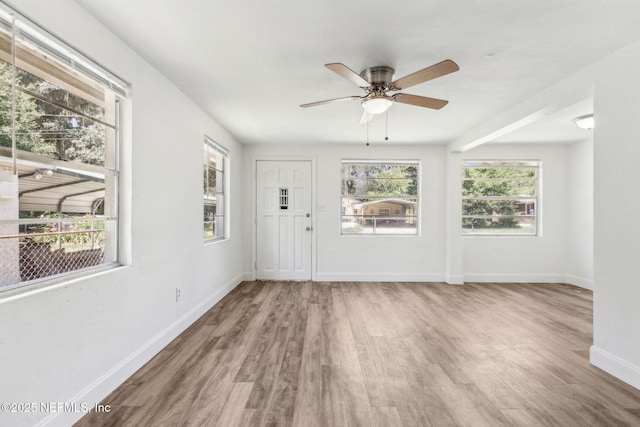 9043 8th Ave, Jacksonville, FL 32208 - entrance foyer featuring wood finished floors, healthy amount of natural light, and a ceiling fan