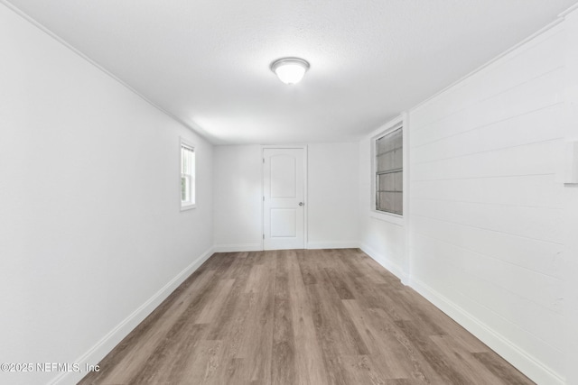 9043 8th Ave, Jacksonville, FL 32208 - spare room featuring wood finished floors, built in shelves, and a textured ceiling