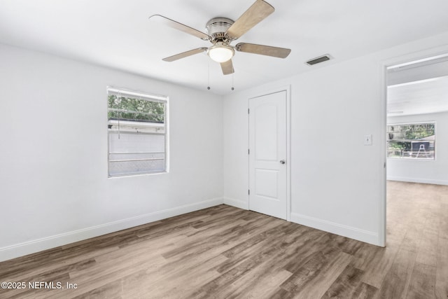 9043 8th Ave, Jacksonville, FL 32208 - unfurnished bedroom with wood finished floors and ceiling fan