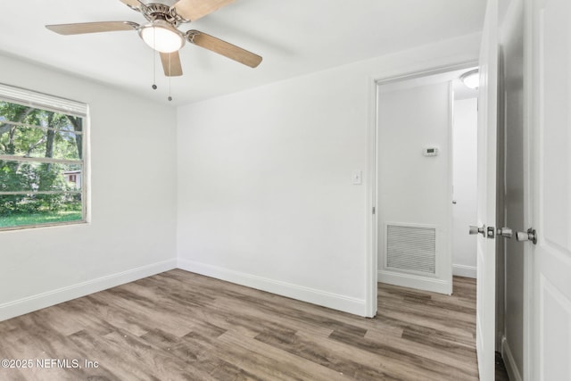 9043 8th Ave, Jacksonville, FL 32208 - unfurnished room featuring wood finished floors and ceiling fan