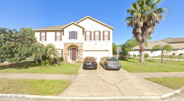 12593 Tropic Dr, Jacksonville, FL 32225 - view of front of house with stucco siding, a garage, driveway, and a front yard