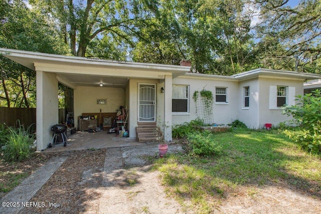 950 Ashton St, Jacksonville, FL 32208 - view of front facade featuring stucco siding and entry steps