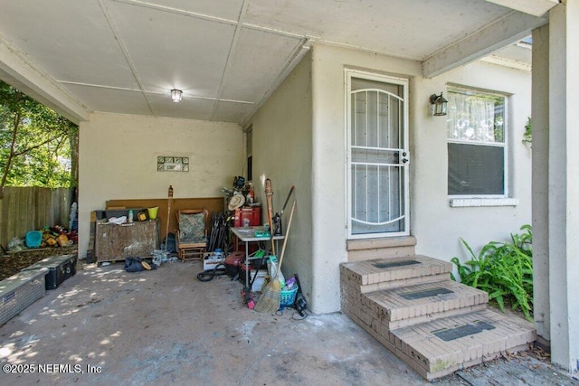 950 Ashton St, Jacksonville, FL 32208 - property entrance with stucco siding and a patio