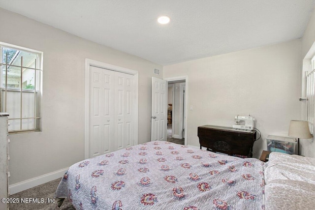 950 Ashton St, Jacksonville, FL 32208 - carpeted bedroom featuring baseboards and a closet