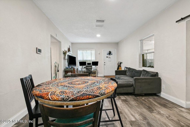950 Ashton St, Jacksonville, FL 32208 - dining area with wood finished floors and a textured ceiling