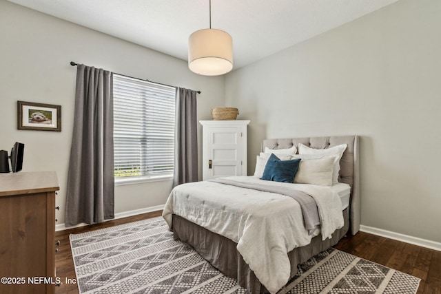 95006 Buckeye Ct, Fernandina Beach, FL 32034 - bedroom with baseboards and dark wood-style flooring