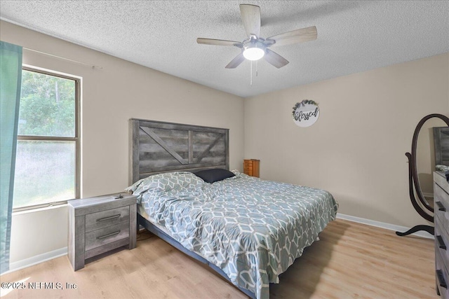 1331 Sheffield Rd, Saint Johns, FL 32259 - bedroom with light wood-type flooring, a textured ceiling, and ceiling fan