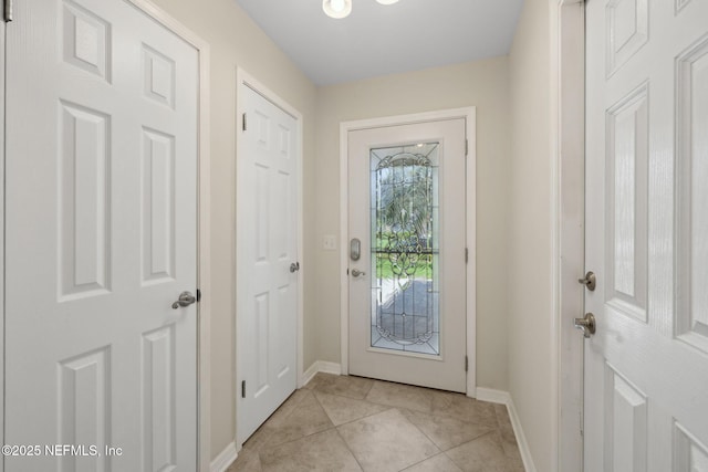 106 Poseidon Ln, Ponte Vedra Beach, FL 32082 - doorway featuring baseboards and light tile patterned floors