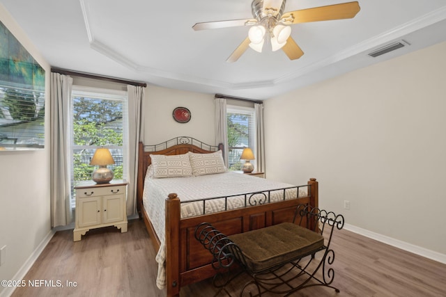 106 Poseidon Ln, Ponte Vedra Beach, FL 32082 - bedroom with light wood-style floors, a raised ceiling, a ceiling fan, and ornamental molding