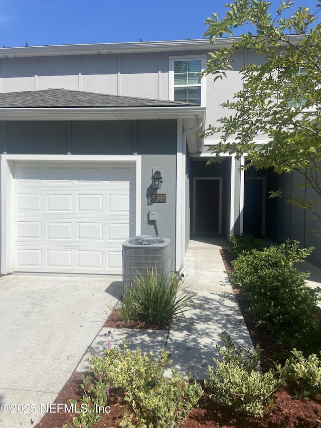 86568 Shortline Cir, Yulee, FL 32097 - doorway to property with a garage and concrete driveway