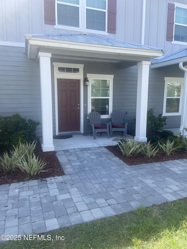 86568 Shortline Cir, Yulee, FL 32097 - entrance to property featuring covered porch and board and batten siding
