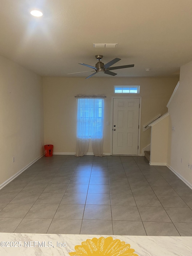 86568 Shortline Cir, Yulee, FL 32097 - foyer entrance featuring stairway, ceiling fan, and light tile patterned flooring