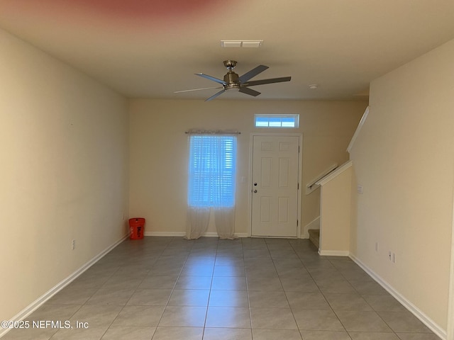 86568 Shortline Cir, Yulee, FL 32097 - foyer entrance with ceiling fan, stairway, and light tile patterned floors