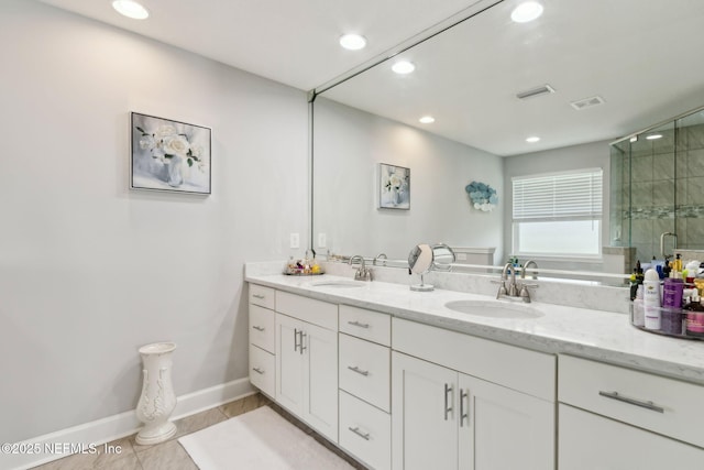 75652 Edwards Rd, Yulee, FL 32097 - bathroom with double vanity, recessed lighting, a shower stall, and tile patterned floors