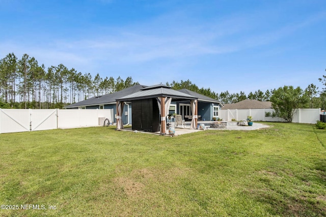 75652 Edwards Rd, Yulee, FL 32097 - rear view of house featuring a gazebo, a patio, and a fenced backyard