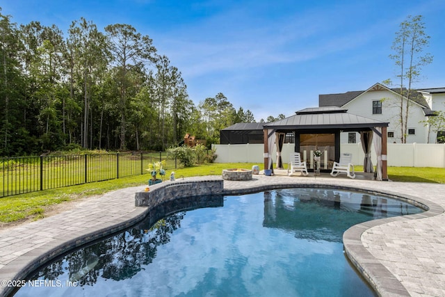 75652 Edwards Rd, Yulee, FL 32097 - view of pool with a gazebo, an outdoor fire pit, a fenced backyard, and a patio