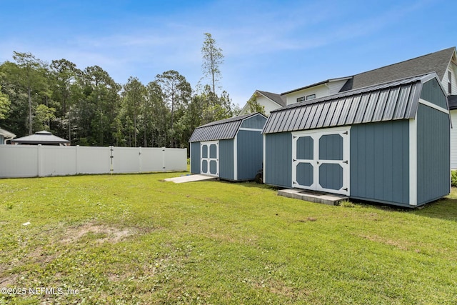 75652 Edwards Rd, Yulee, FL 32097 - fenced backyard featuring a storage unit and a gate