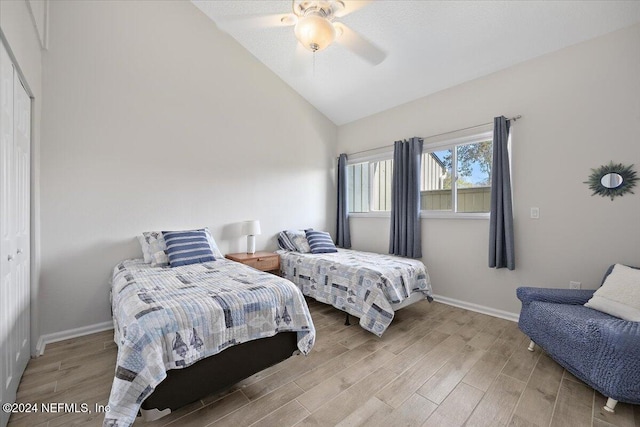 9990 Sawgrass Dr E, Ponte Vedra Beach, FL 32082 - bedroom with light wood-style flooring, lofted ceiling, ceiling fan, and a closet