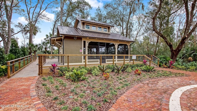 146 Whistling Palm Ct Lot 90, Ponte Vedra, FL 32081 - view of front facade with a deck and a metal roof