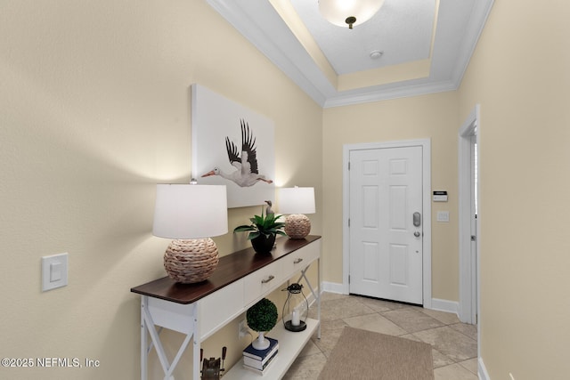 13846 Atlantic Blvd Unit 103, Jacksonville, FL 32225 - foyer entrance with light tile patterned floors, a tray ceiling, and crown molding