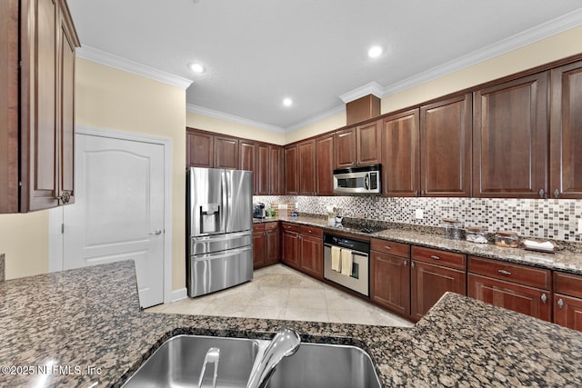 13846 Atlantic Blvd Unit 103, Jacksonville, FL 32225 - kitchen with stainless steel appliances, backsplash, crown molding, dark stone counters, and recessed lighting