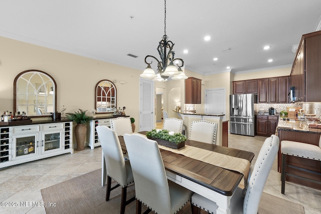 13846 Atlantic Blvd Unit 103, Jacksonville, FL 32225 - dining room featuring crown molding, a chandelier, and recessed lighting