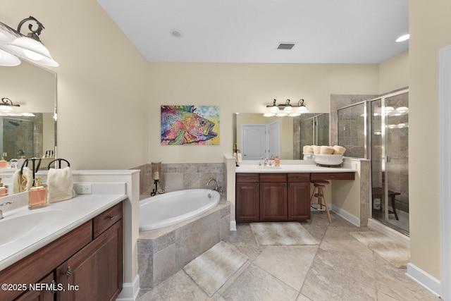 13846 Atlantic Blvd Unit 103, Jacksonville, FL 32225 - bathroom with a stall shower, two vanities, a garden tub, and tile patterned flooring