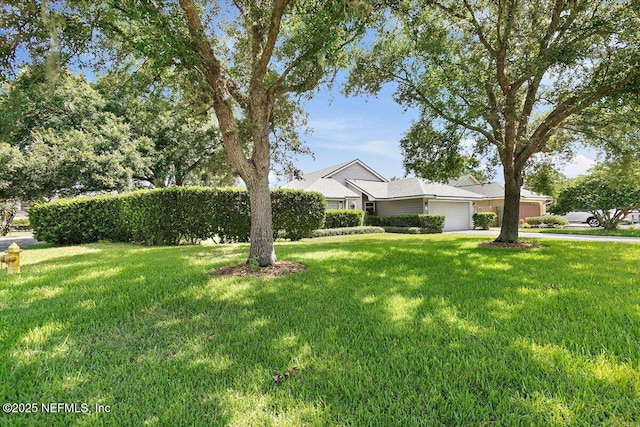 101 Duck Bill Cv, Ponte Vedra Beach, FL 32082 - view of front facade with an attached garage, a front yard, and driveway