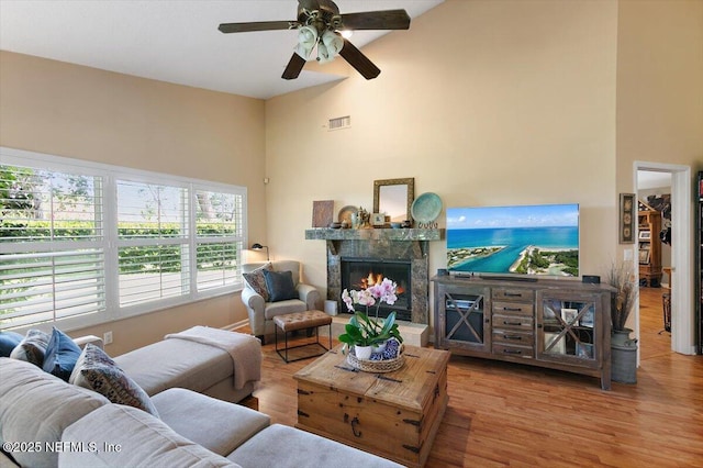 101 Duck Bill Cv, Ponte Vedra Beach, FL 32082 - living room with high vaulted ceiling, a premium fireplace, a ceiling fan, and wood finished floors