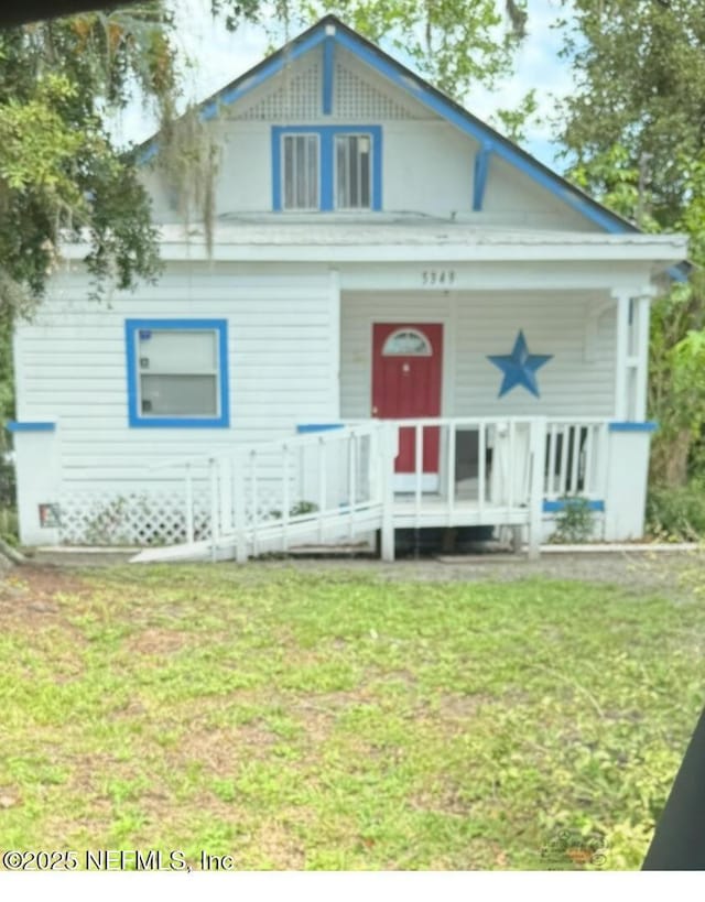 5349 Rio Grande Ave, Jacksonville, FL 32254 - victorian house with a porch and a front lawn