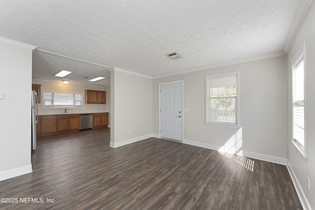 103 Chapin St, Saint Augustine, FL 32084 - unfurnished living room featuring dark wood-style floors, plenty of natural light, a textured ceiling, and ornamental molding
