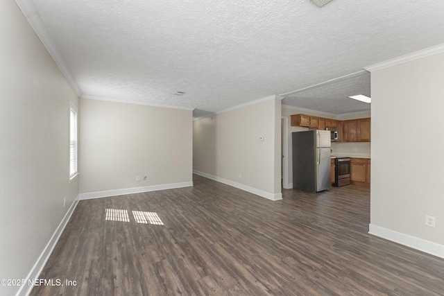 103 Chapin St, Saint Augustine, FL 32084 - unfurnished living room featuring dark wood-type flooring, a textured ceiling, and crown molding