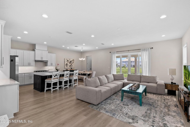 106 Rum Runner Way, Saint Johns, FL 32259 - living area with light wood-style floors, recessed lighting, and a chandelier