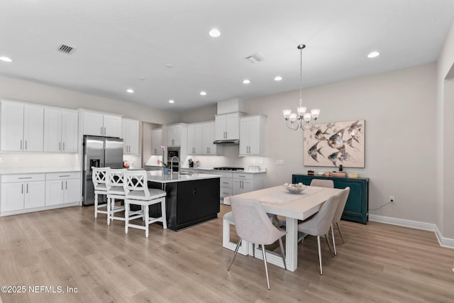 106 Rum Runner Way, Saint Johns, FL 32259 - dining space with a chandelier, light wood finished floors, and recessed lighting