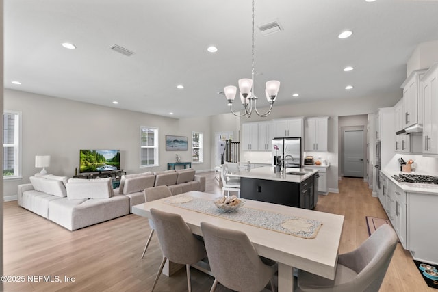 106 Rum Runner Way, Saint Johns, FL 32259 - dining space featuring a chandelier, recessed lighting, and light wood-style floors