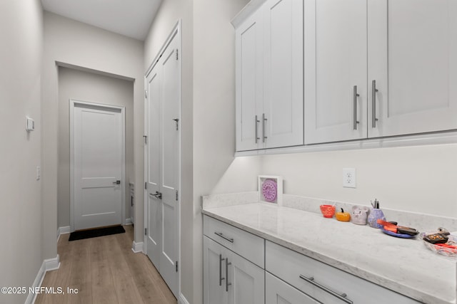 106 Rum Runner Way, Saint Johns, FL 32259 - laundry room featuring light wood-style floors and baseboards