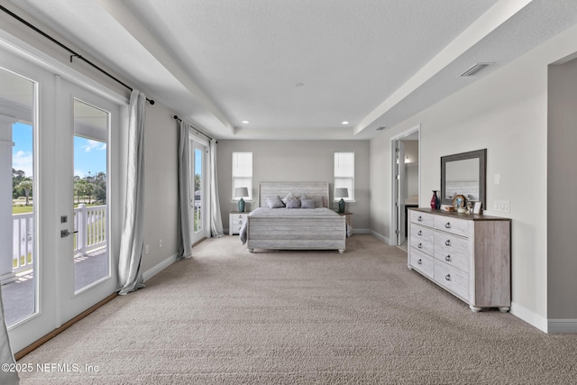 106 Rum Runner Way, Saint Johns, FL 32259 - bedroom featuring access to exterior, light carpet, a tray ceiling, and recessed lighting