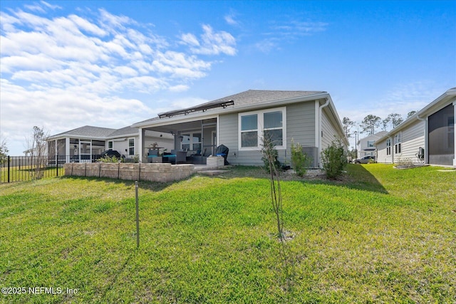 20 Willow St, Palm Coast, FL 32164 - rear view of house with a sunroom and a patio area