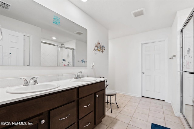 20 Willow St, Palm Coast, FL 32164 - full bath featuring a stall shower, tile patterned floors, and double vanity