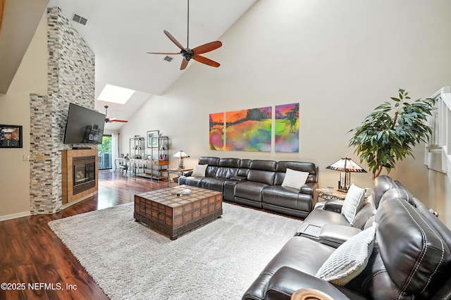 4251 Monument Rd Unit 805, Jacksonville, FL 32225 - living room featuring high vaulted ceiling, a skylight, ceiling fan, wood finished floors, and a glass covered fireplace