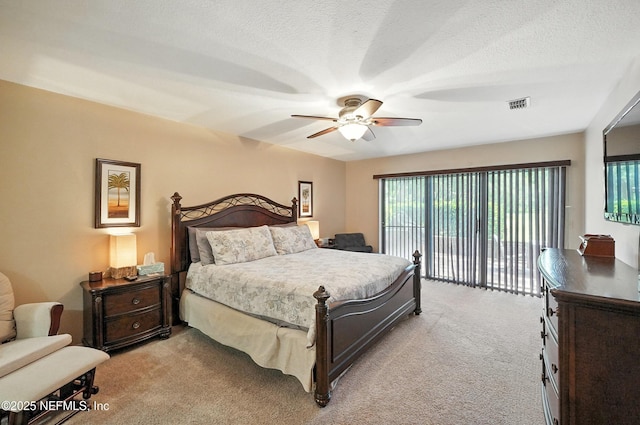 4251 Monument Rd Unit 805, Jacksonville, FL 32225 - carpeted bedroom featuring access to exterior, a ceiling fan, and a textured ceiling