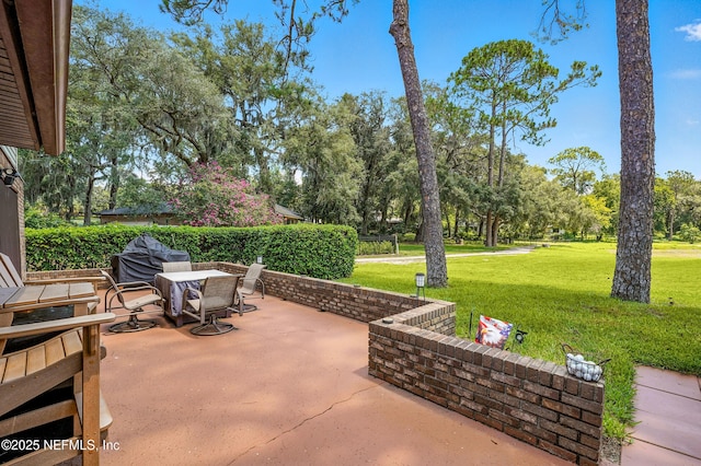 4251 Monument Rd Unit 805, Jacksonville, FL 32225 - view of patio / terrace with area for grilling, view of wooded area, and outdoor dining space