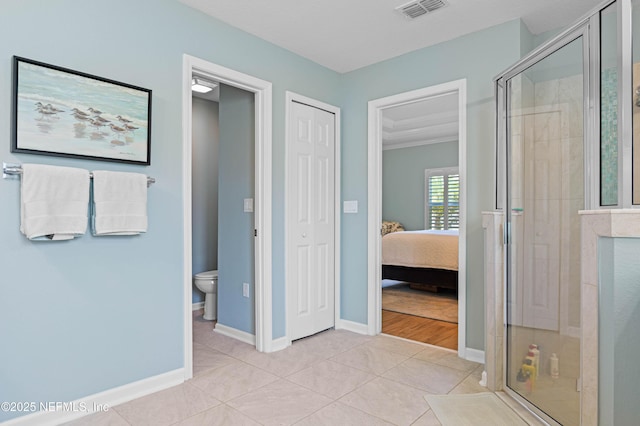 96740 Quartz Ln, Yulee, FL 32097 - full bathroom with a stall shower, ensuite bathroom, and tile patterned flooring