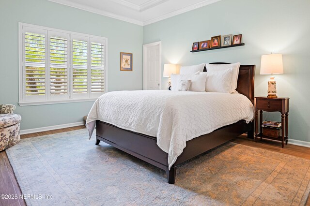 96740 Quartz Ln, Yulee, FL 32097 - bedroom with wood finished floors and crown molding