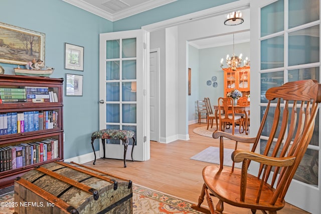 96740 Quartz Ln, Yulee, FL 32097 - living area featuring a chandelier, ornamental molding, and wood finished floors